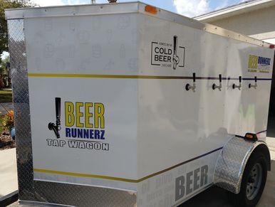 This enclosed trailer has 4 taps on the side to dispense multiple kegs at once, 