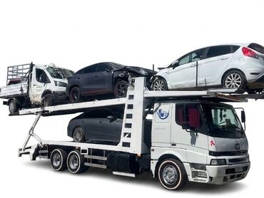 Car transporter truck loaded with three cars on white background.