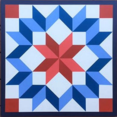Geometric quilt pattern with red and blue star design.