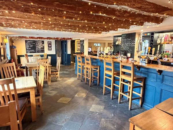 Inside the country pub by the bar with old oak beams
