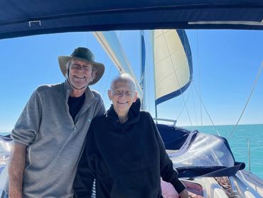 Captain Mike standing next to Martha on her first ever sailboat ride.