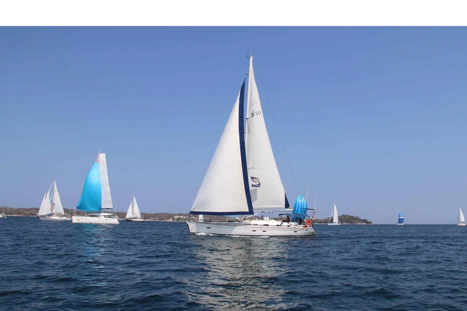 Several sailboats navigate the calm waters of Marathon FL, perfect for a day sailing adventure.