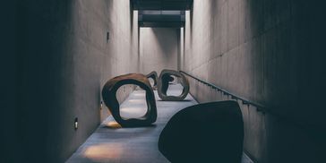 Photo by Andrea De Santis on unsplash.com. couple-of-large-sculptures-sitting-on-top-of-cement-floor
