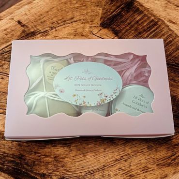 A pink gift box with natural skincare products from Lil' Pots of Goodness.