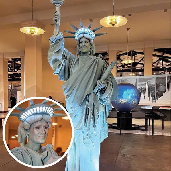 A photo of the living Statue of Liberty on Ellis Island.