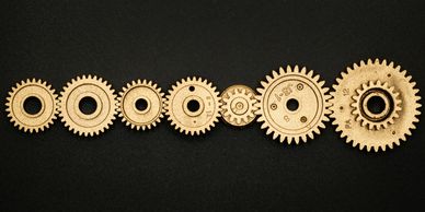 cogs in a wheel to symbolise recruitment and executive recruitment and executive search