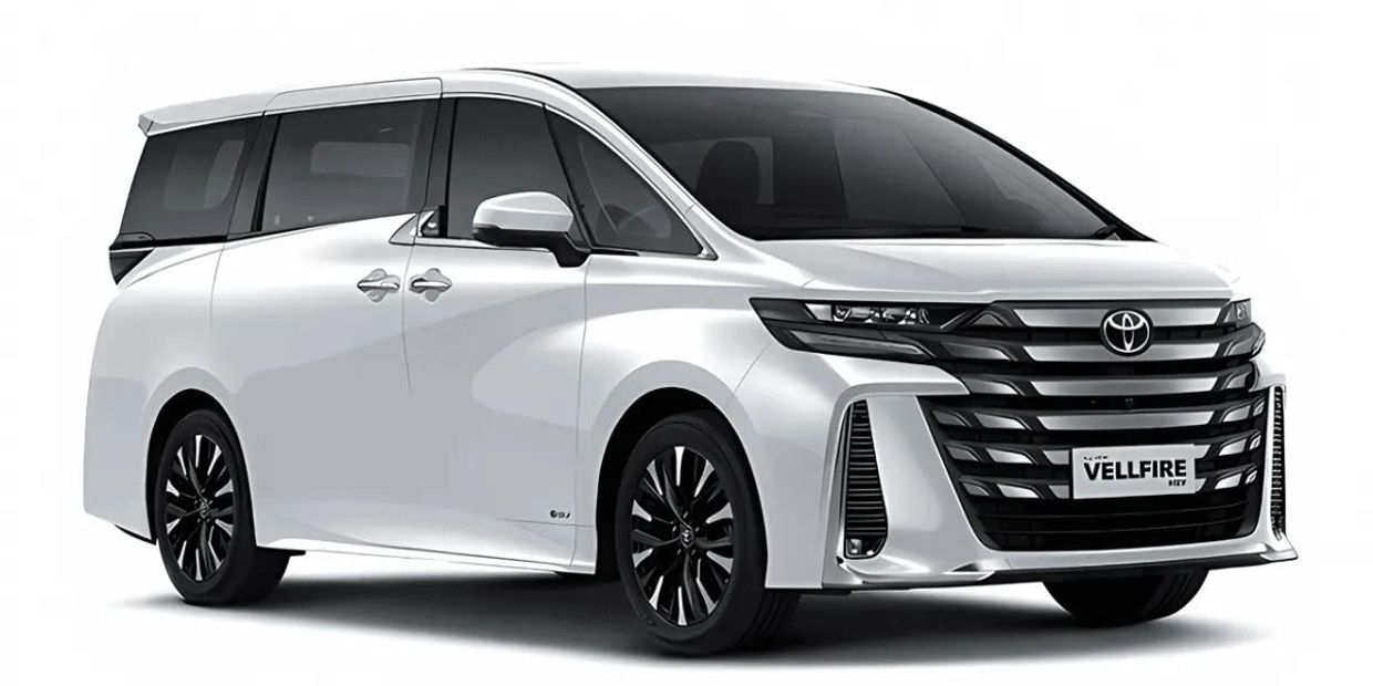 Sleek white Toyota Vellfire minivan with bold front grille and black accents.