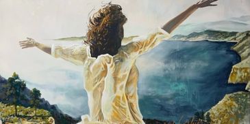 A woman in a white dress stands with arms outstretched overlooking a large body of water and cliffs.