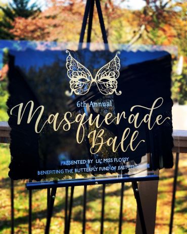 Sign for the 6th Annual Masquerade Ball.