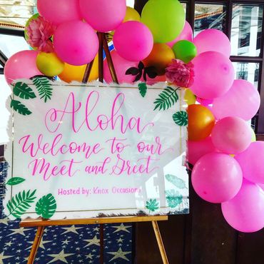 Decorative sign with balloons for a meet and greet.