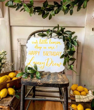 Birthday sign for Lainey Drew decorated with lemons and leaves.