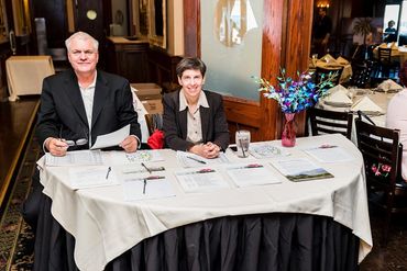 Both are seating on seating Table