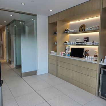Modern interior with glass doors and shelves of health supplements.
