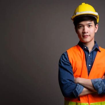 Young construction worker in safety gear.