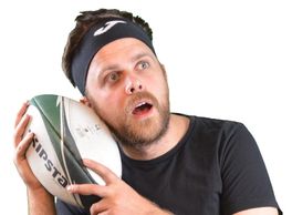 Dan listening to the rugby ball