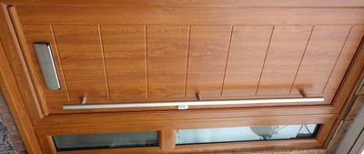 Italian style solid core composite front door fitted in Hucknall. Golden Oak frame and Golden Oak do