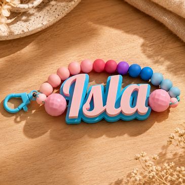 Colorful beaded keychain with the name Isla.