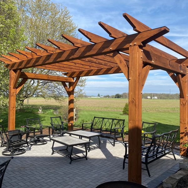Custom timber frame gazebo in a backyard in Niagara-on-the-Lake, ON