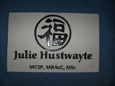 A physiotherapist and acupuncturist sign In Peterborough Cambridgeshire UK