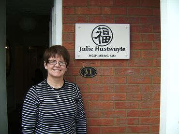 A physiotherapist and acupuncturist sign In Peterborough Cambridgeshire UK