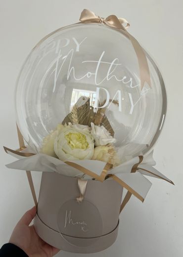 Nude coloured bubble balloon for Mother's day, finished with nude ribbon and white personalisation.
