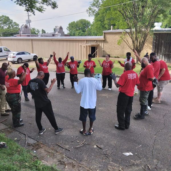 Homeless residents participating in a circle