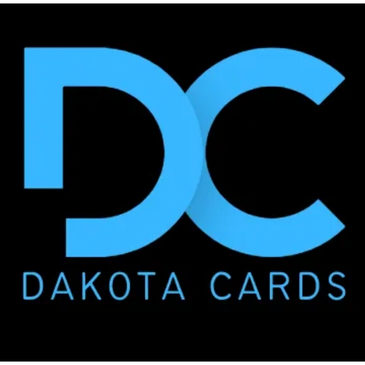 Blue DC logo for Dakota Cards on black background.