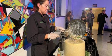 Chef Ali on the Pecorino Romano Cheese Wheel pasta station