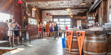 People drinking wine inside the Hatch Winery tasting  room