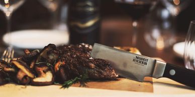 Close-up of a meat cleaver in a steak