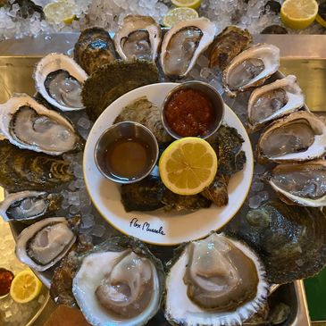 Oysters lemons sauces ice tray Belon Malpeque west coast European shucker flex mussels