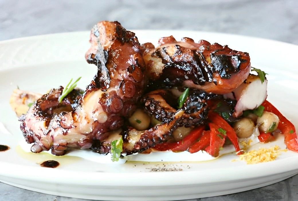 grilled octopus with chick peas and roasted peppers