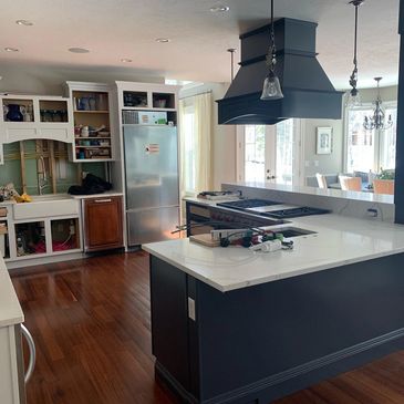 Kitchen island cabinets with hood painted with emerald paint