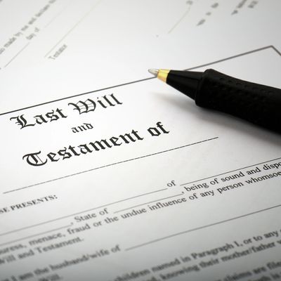 A Last Will and Testament document with a pen resting on it.