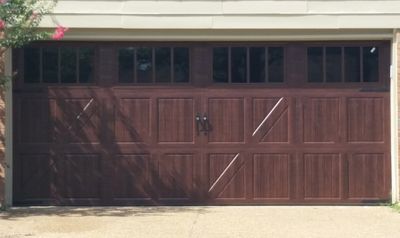 Classica carriage garage door in mahogany wood grain by Bartlett Garage Doors.