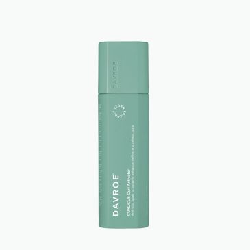 Green cylindrical skincare product bottle with brand name Davroe.