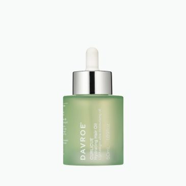 Green glass dropper bottle of Dayroe oil.