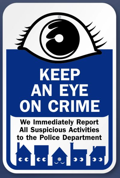 Sign urging residents to report suspicious activities to the police.
