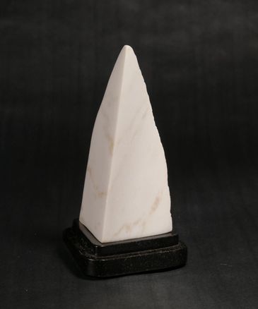 CO Yule marble pyramid sculpture. Two sides are highly polished, the third side is natural stone