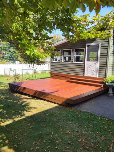 Replaced rotten boarrds, pressure washed and stained.