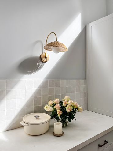 Coastal kitchen. Light grey shaker cabinetry, brass handles white concrete benchtop, handmade tiles
