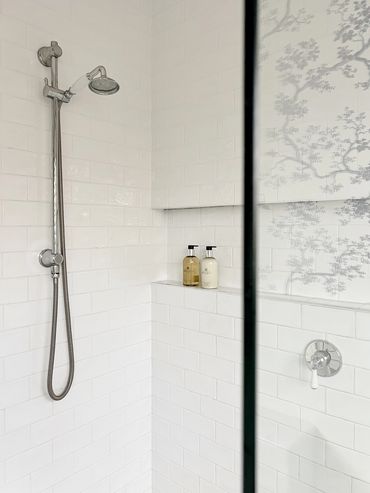 Light-filled Hamptons bathroom with traditional tapware