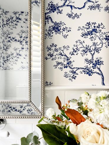 Light-filled Hamptons bathroom with custom Florence Broadhurst wallpaper.