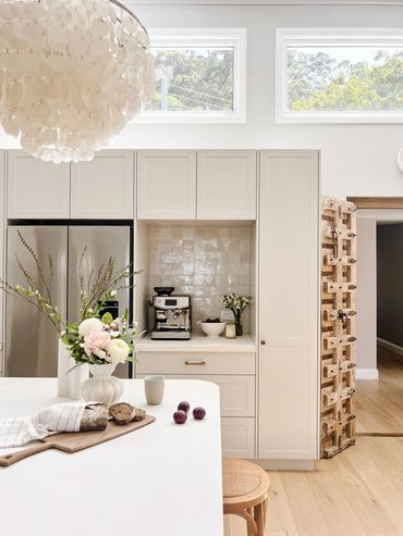 Coastal Kitchen with light grey shaker cabinetry, concrete benchtop and zellige tiles.