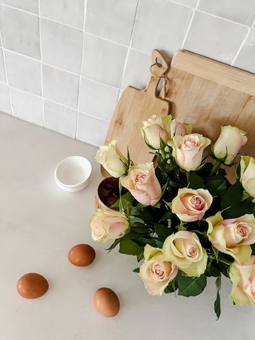 Coastal bar. Light grey shaker cabinetry, white concrete benchtop, handmade tiles.