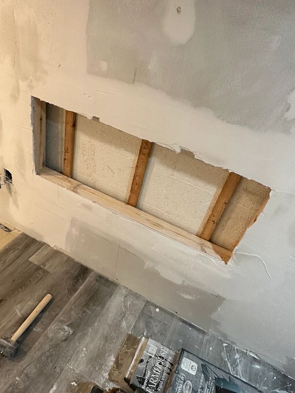 In this picture we framed and missed the dry wall around it to get prepared for sanding and installa