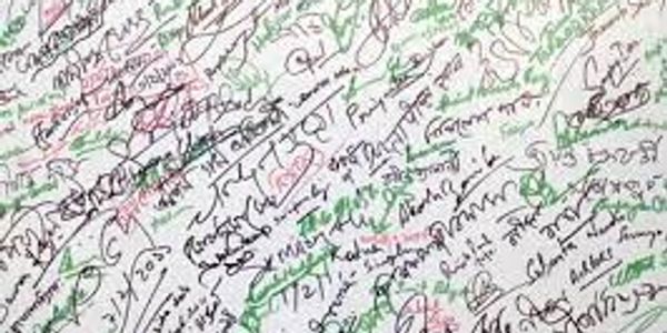 A densely filled sheet with colorful handwritten notes and signatures.