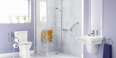 Shower conversion for seniors with folding shower seat and safety grab bars.