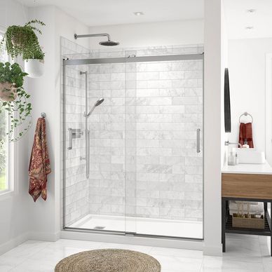 Shower wall surround that looks like marble tile installed with a tub to shower conversion.