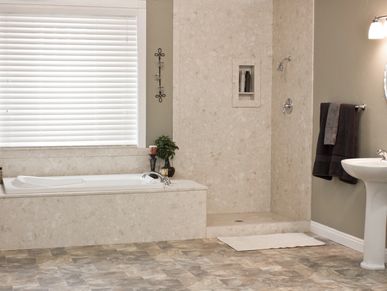 Shower remodel with marble shower surround integrated into soaker tub with marble tub surround.